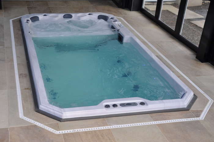 swim-spa-installed-in-home-turned-on-with-lights